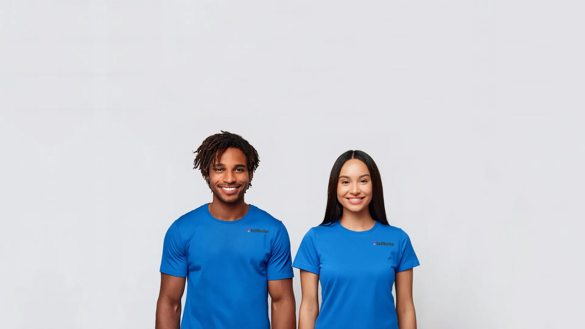 A young man and a young woman are shown wearing a Tellbrite Customer Support blue shirt.